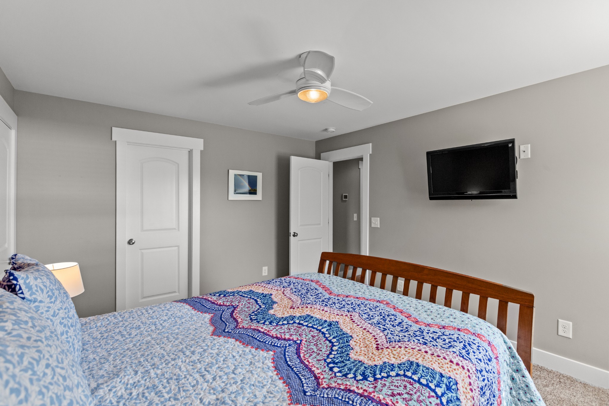 11484 Patterson Road Rockvale, TN 37153 - Photo 26 of 32 a bedroom with a bed and a flat tv screen on dresser