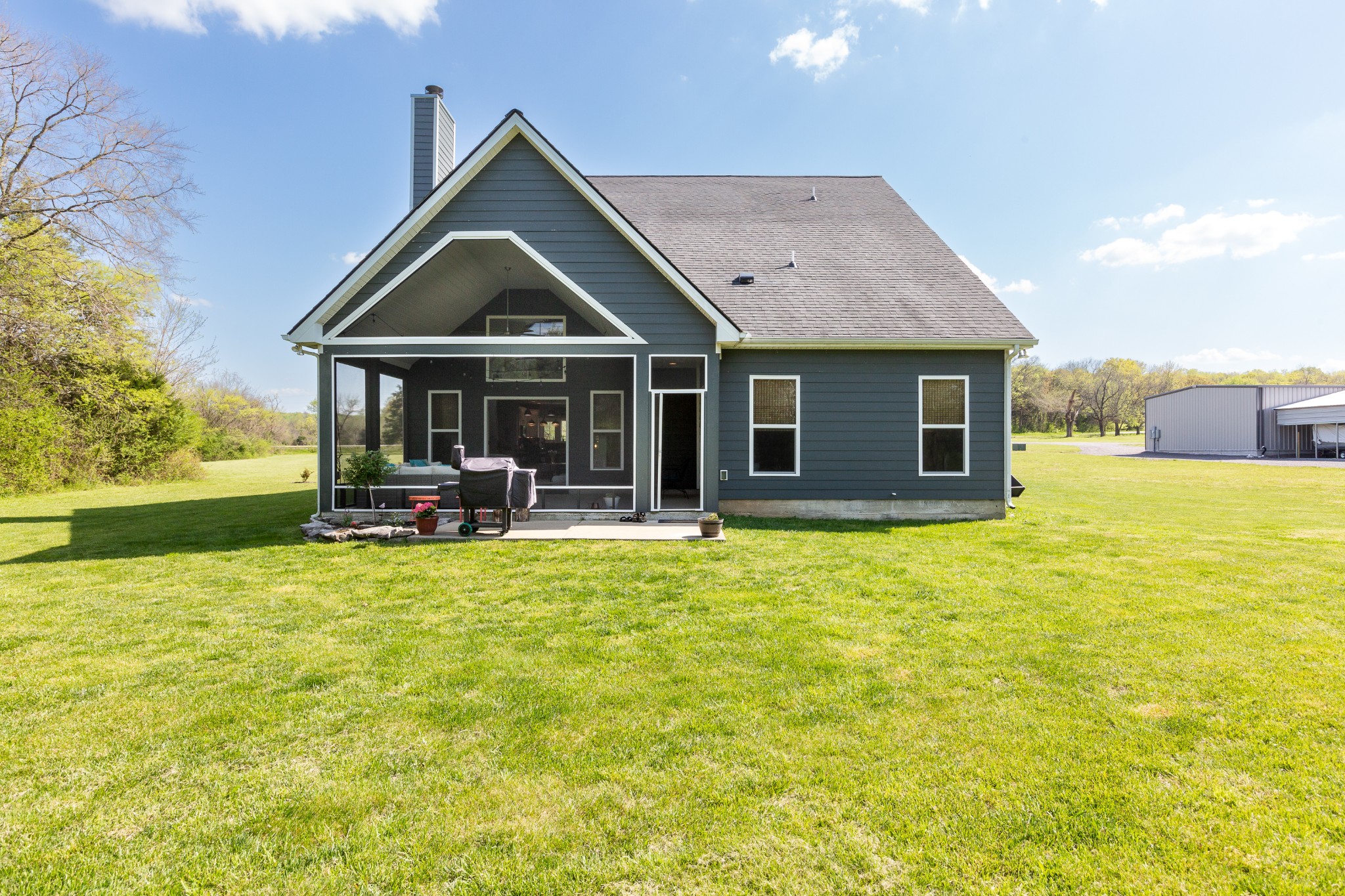 11484 Patterson Road Rockvale, TN 37153 - Photo 32 of 32 a view of a house with pool and a yard
