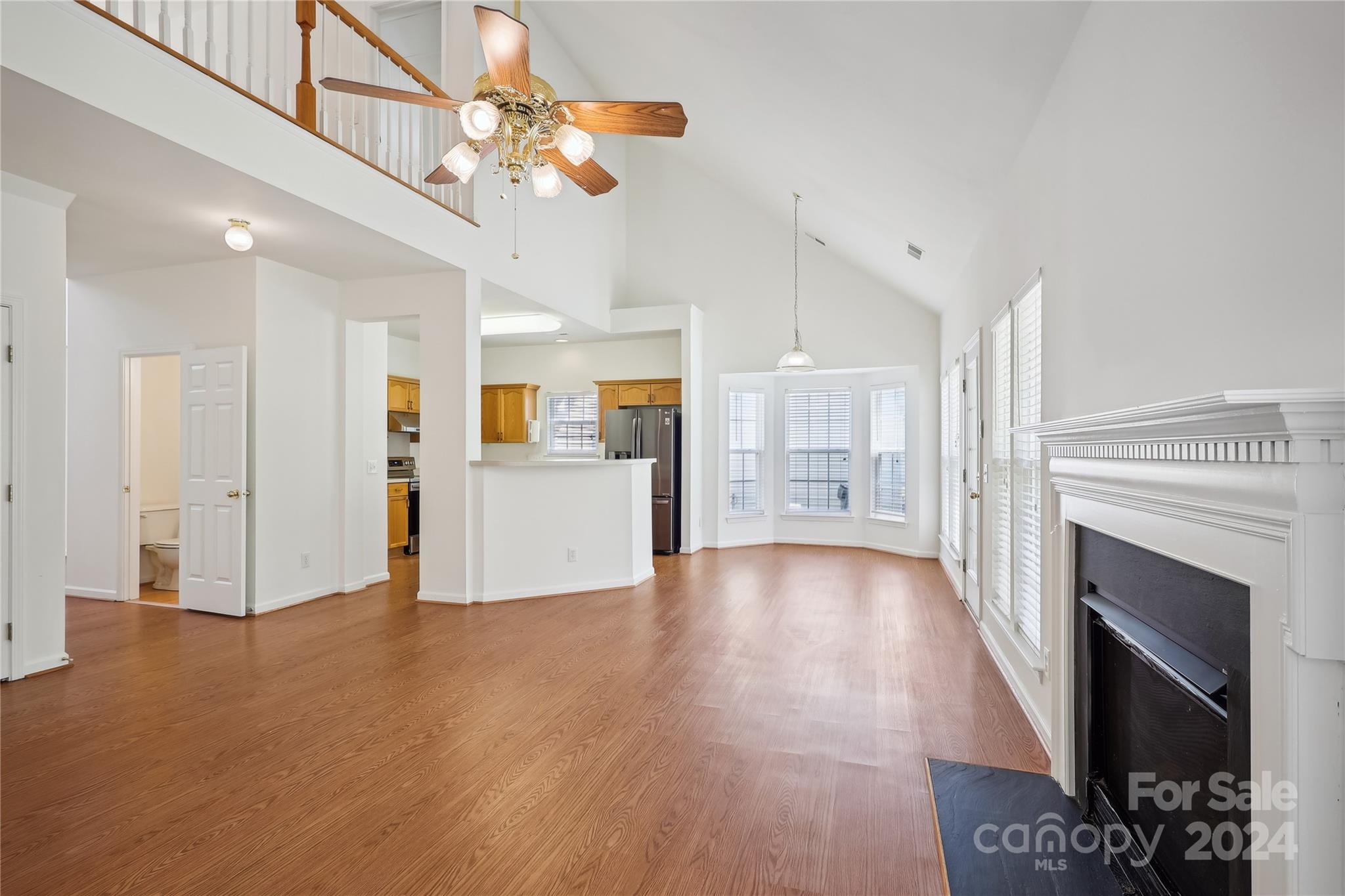 14336 Williams Glenn Road Charlotte, NC 28273 - Photo 11 of 39 a view of a kitchen with wooden floor and a kitchen