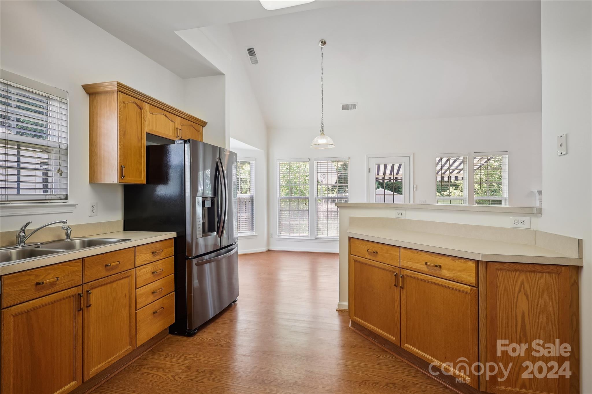 14336 Williams Glenn Road Charlotte, NC 28273 - Photo 16 of 39 a kitchen with stainless steel appliances a refrigerator and a sink