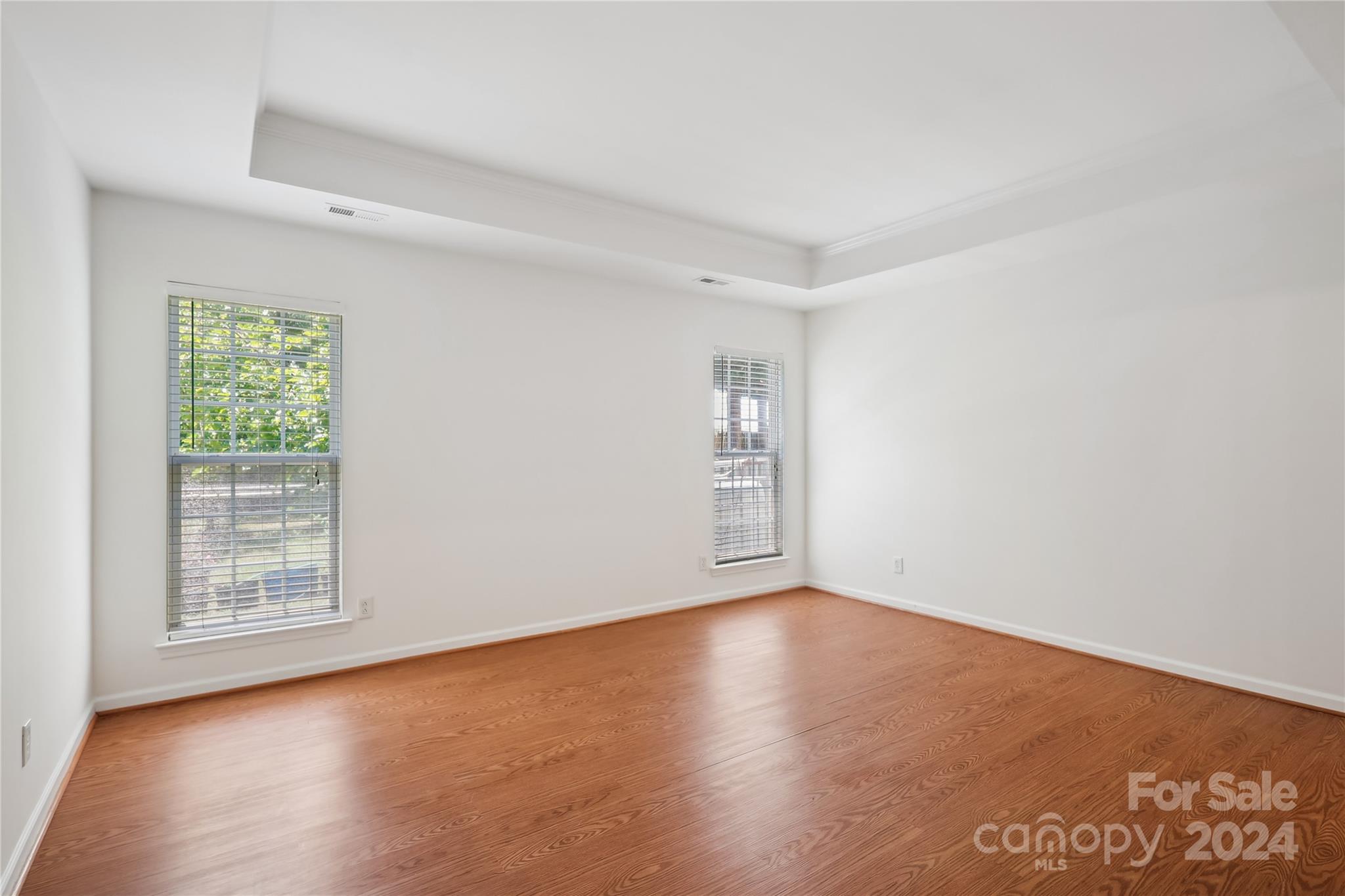 14336 Williams Glenn Road Charlotte, NC 28273 - Photo 21 of 39 an empty room with wooden floor and windows