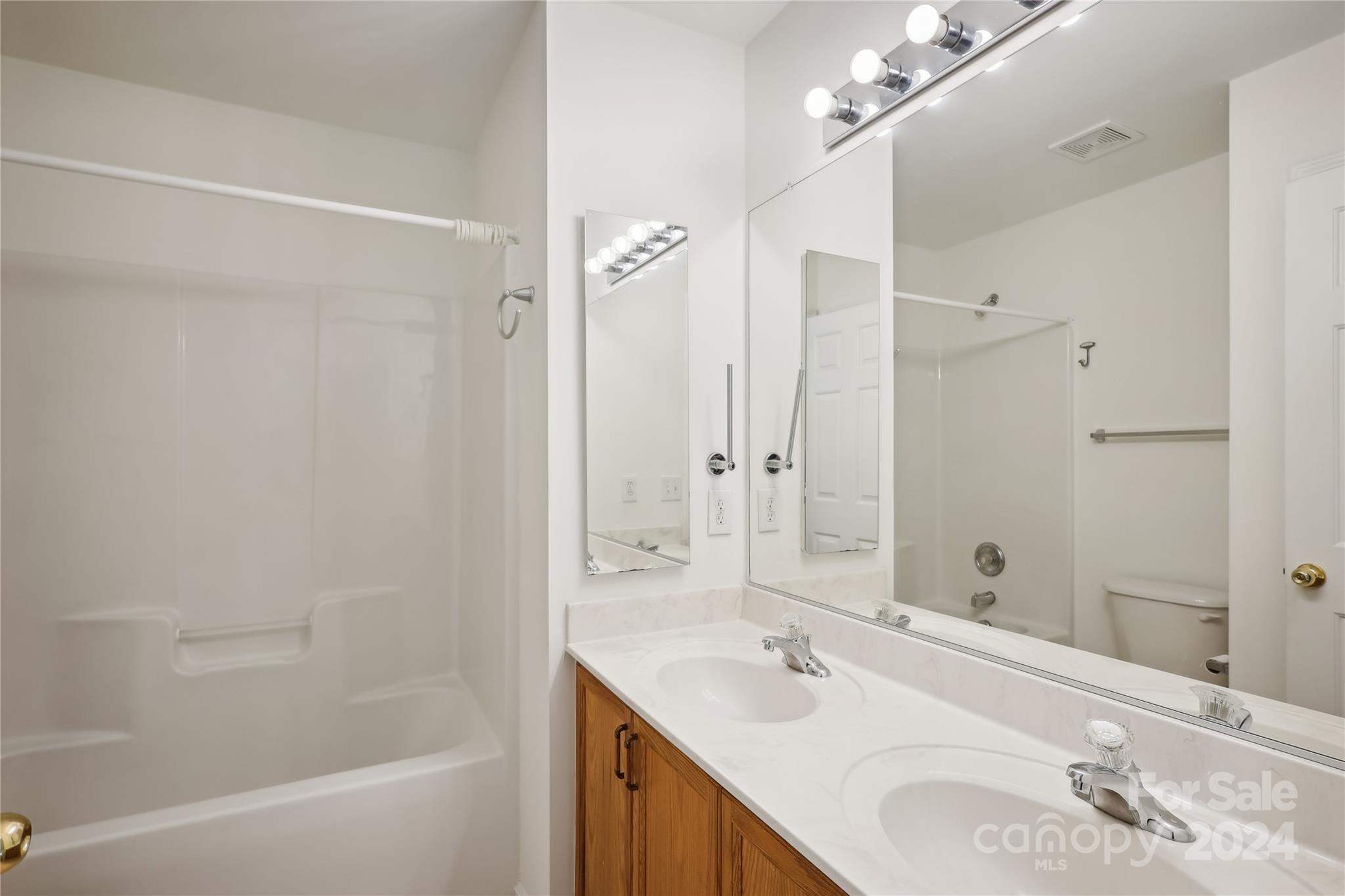 14336 Williams Glenn Road Charlotte, NC 28273 - Photo 24 of 39 a bathroom with a sink vanity tub and shower