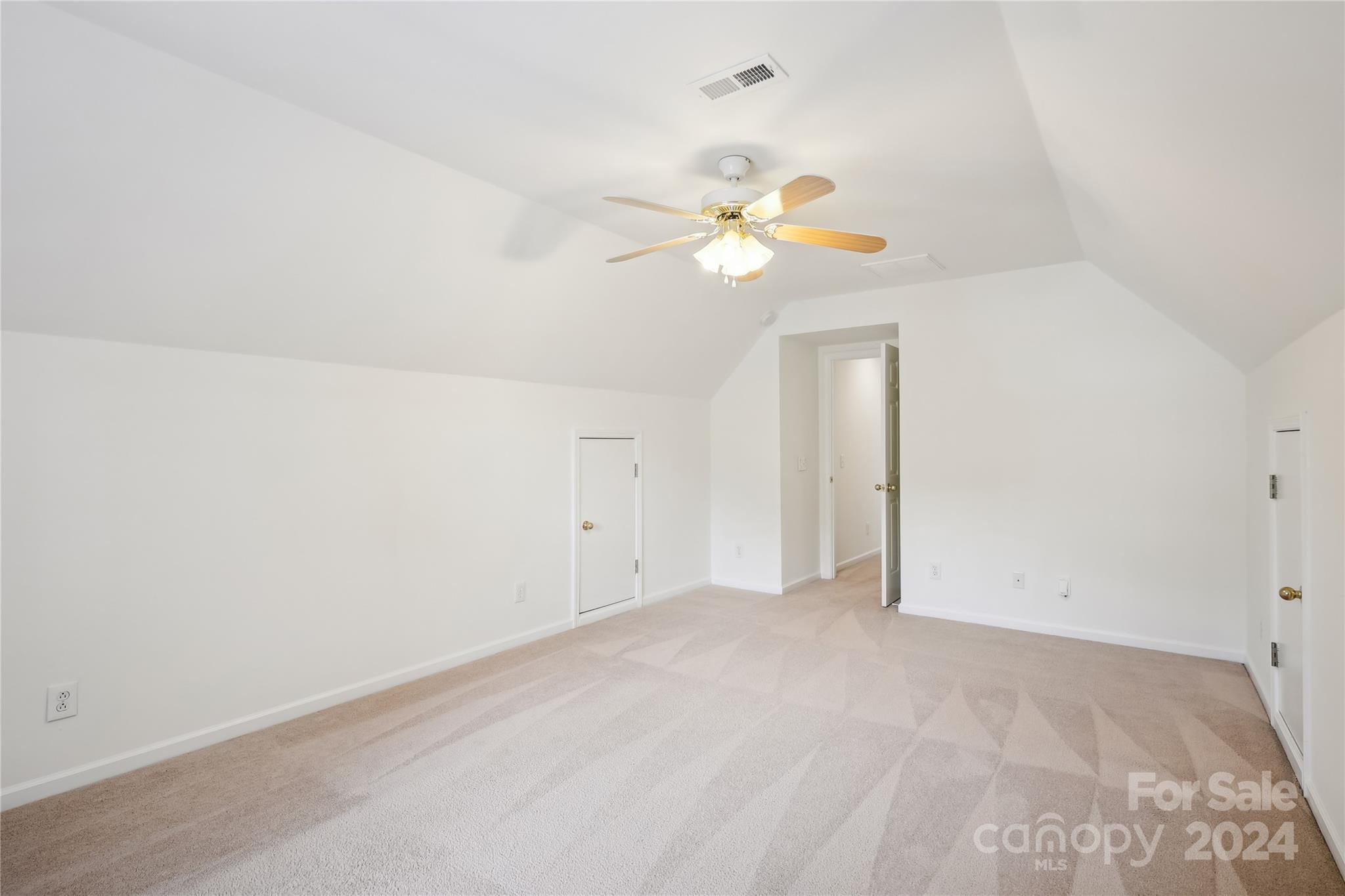 14336 Williams Glenn Road Charlotte, NC 28273 - Photo 29 of 39 an empty room with a window and a ceiling fan