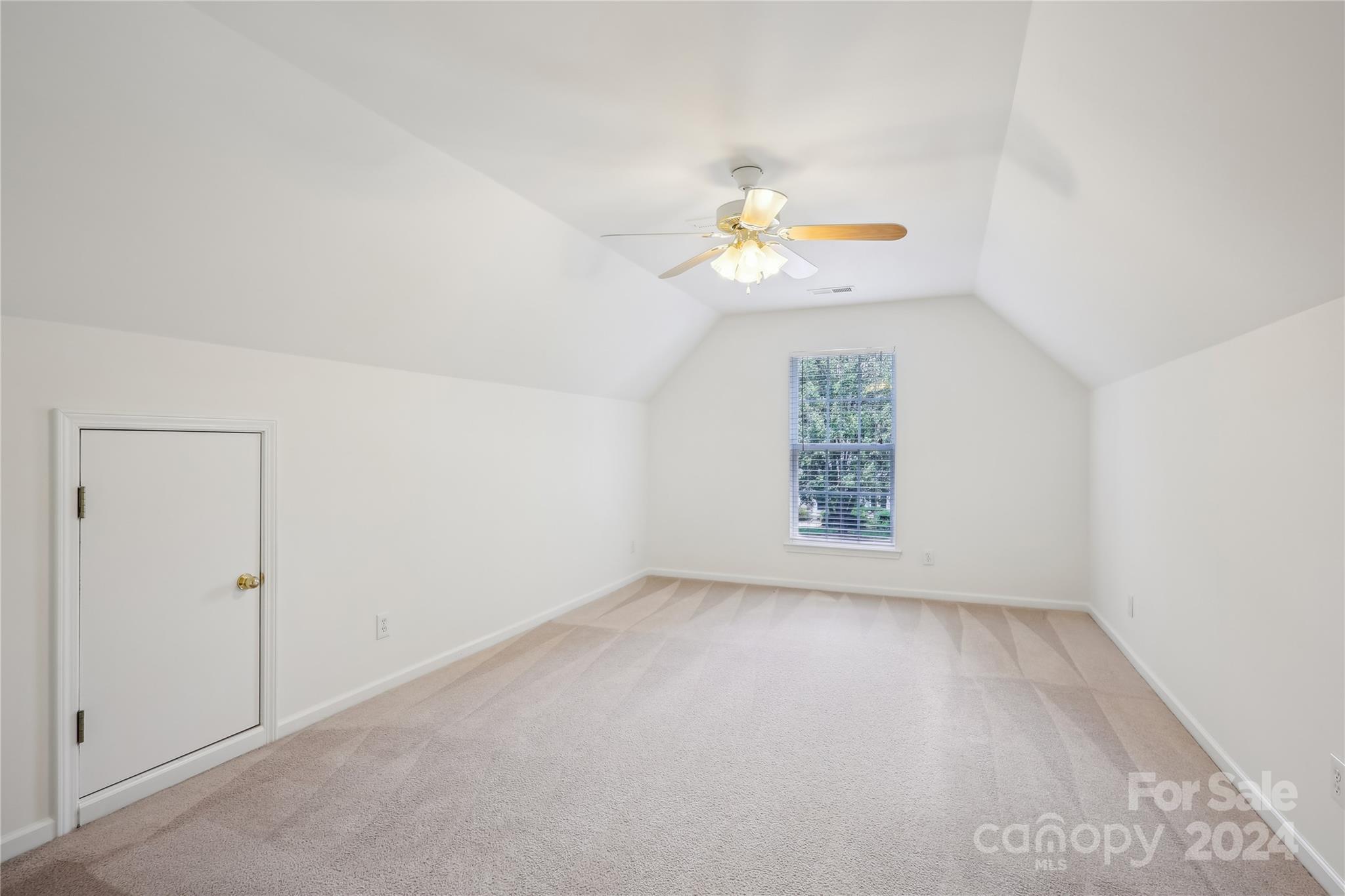 14336 Williams Glenn Road Charlotte, NC 28273 - Photo 30 of 39 an empty room with windows and flowerpot
