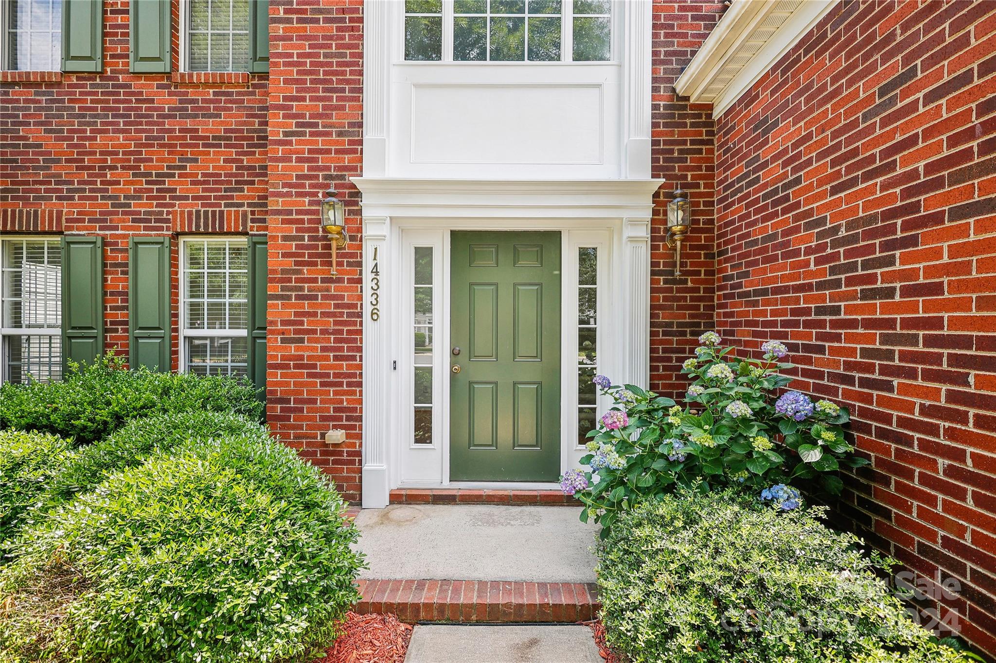 14336 Williams Glenn Road Charlotte, NC 28273 - Photo 3 of 39 a view of a brick house with plants