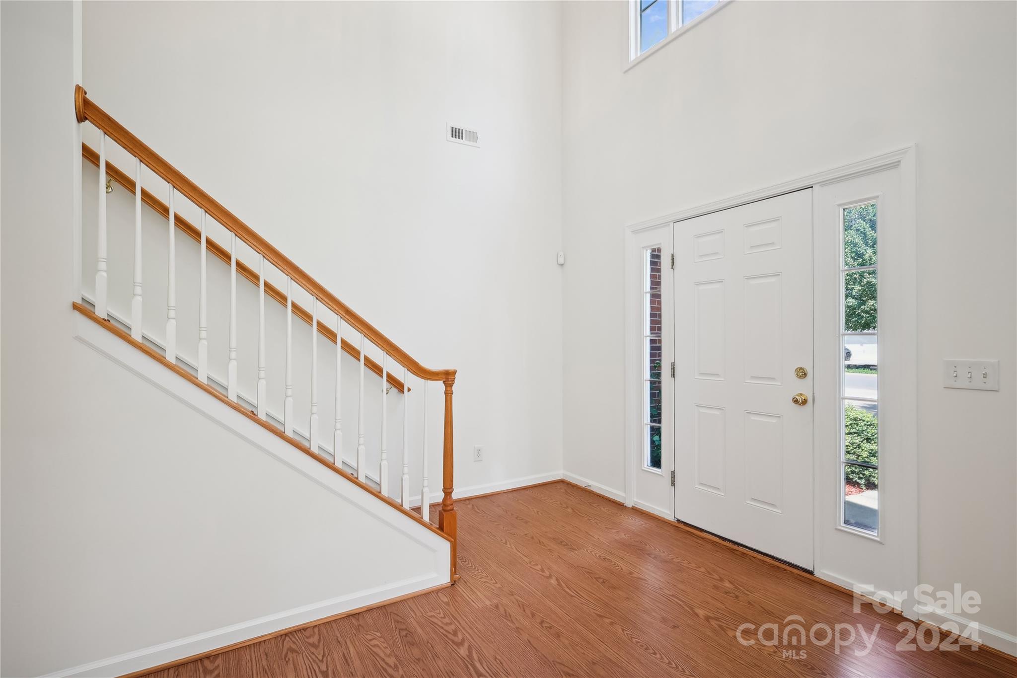 14336 Williams Glenn Road Charlotte, NC 28273 - Photo 4 of 39 a view of staircase with wooden floor and stairs