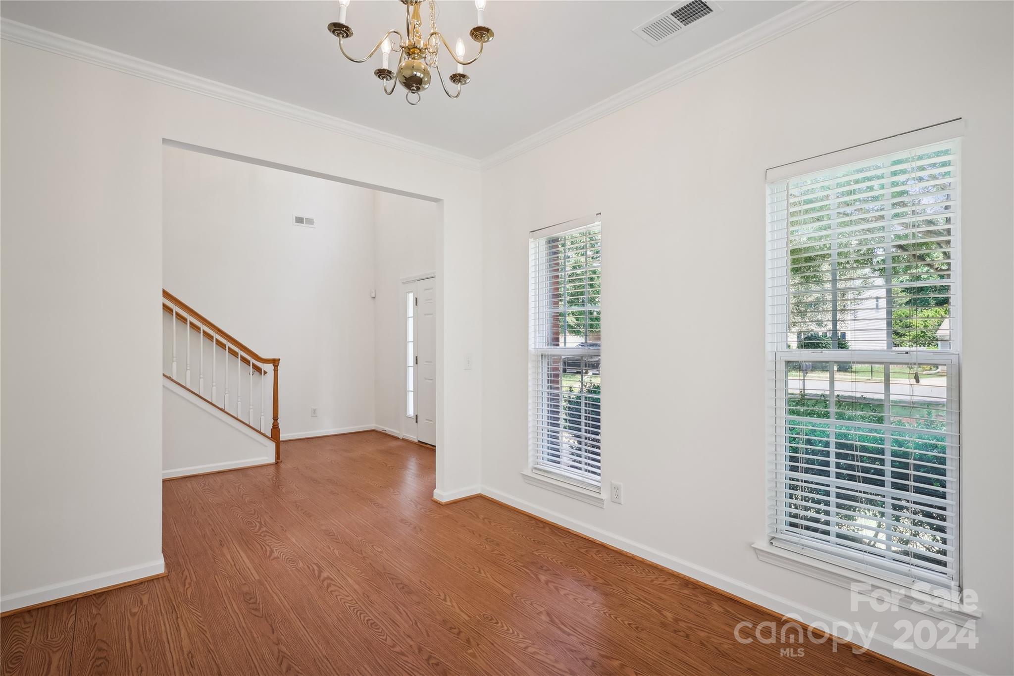 14336 Williams Glenn Road Charlotte, NC 28273 - Photo 5 of 39 a view of an empty room with a window and wooden floor