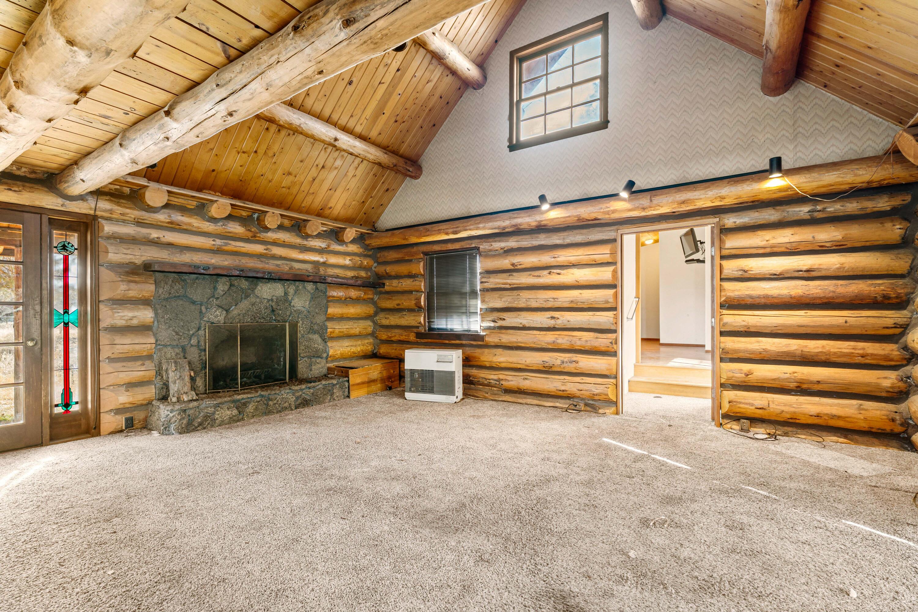 21910 Rickard Road Bend, OR 97702 - Photo 4 of 42 a view of an empty room with a staircase