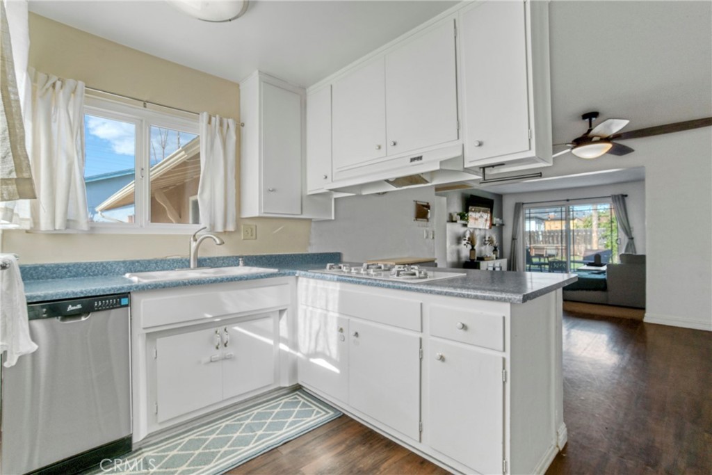 2390 Workman Avenue Simi Valley, CA 93063 - Photo 11 of 21 a kitchen with granite countertop white cabinets and a sink