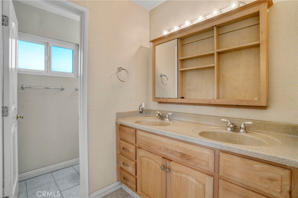 2390 Workman Avenue Simi Valley, CA 93063 - Photo 14 of 21 a bathroom with a sink and a mirror