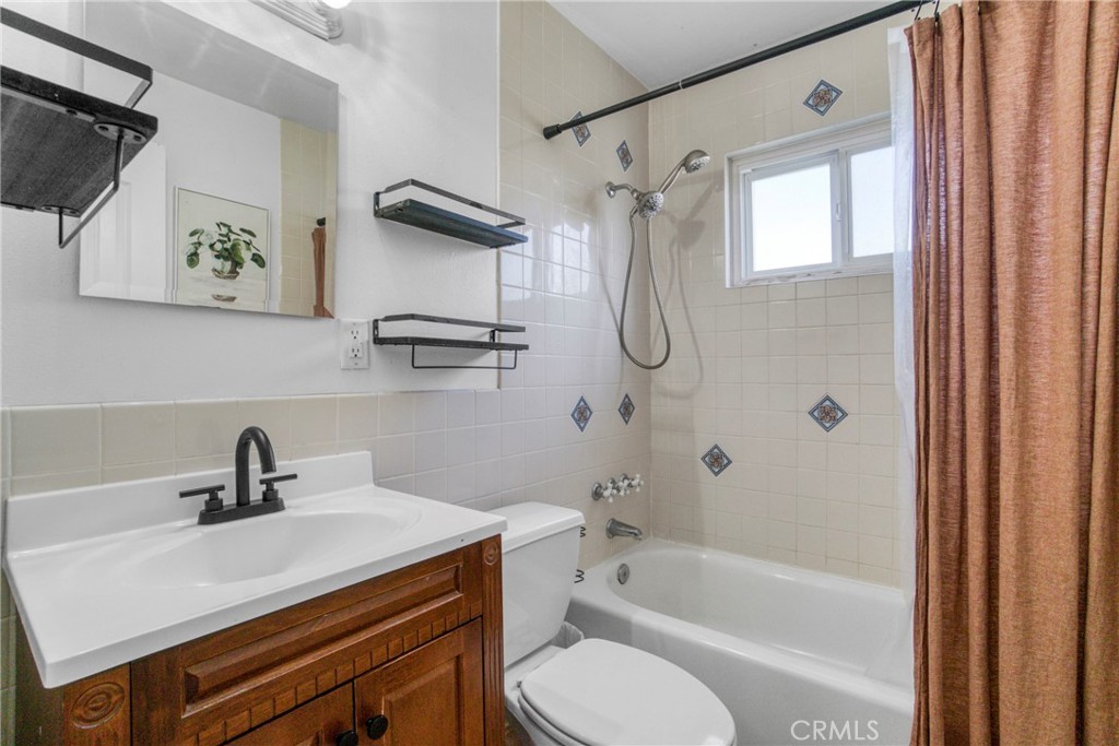 2390 Workman Avenue Simi Valley, CA 93063 - Photo 16 of 21 a bathroom with a sink a toilet and shower
