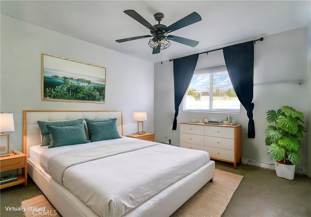 2390 Workman Avenue Simi Valley, CA 93063 - Photo 17 of 21 a bedroom with a bed and a chandelier