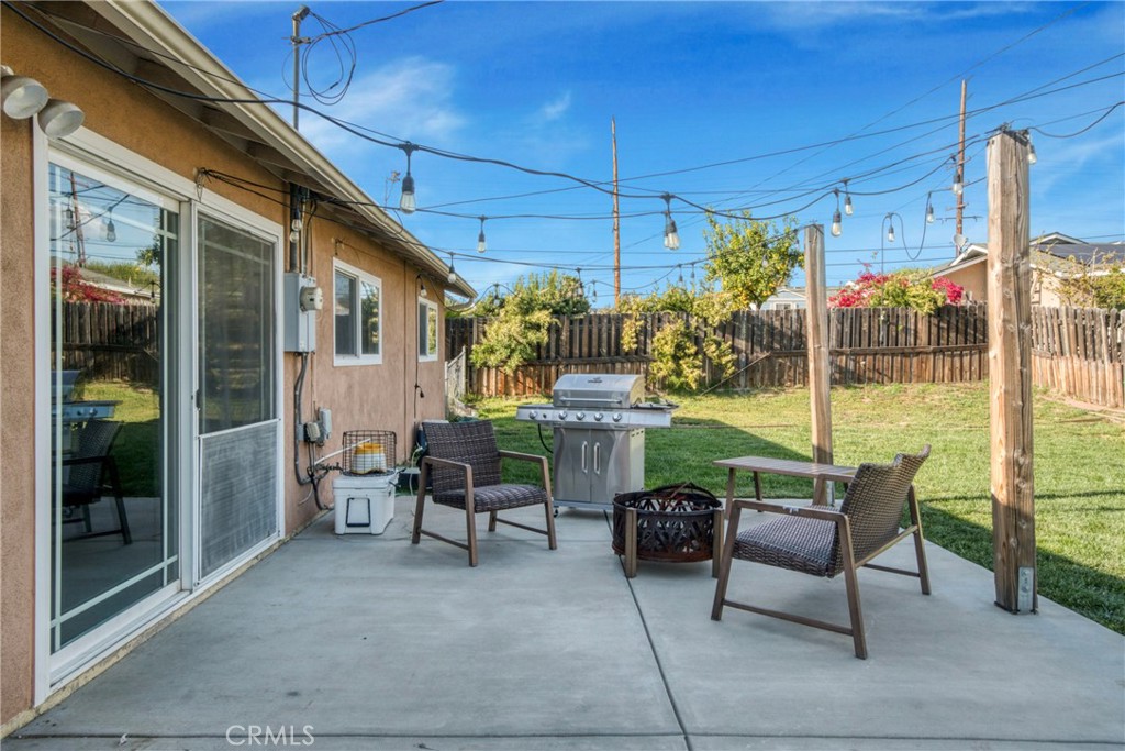 2390 Workman Avenue Simi Valley, CA 93063 - Photo 20 of 21 a view of a patio with a table and chairs and potted plants