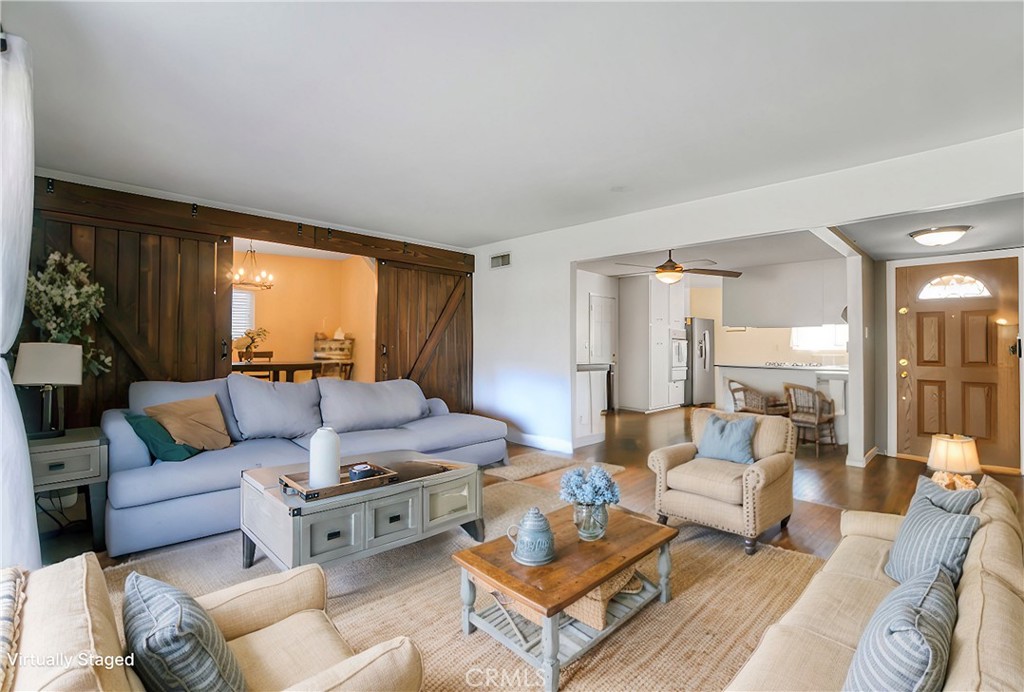2390 Workman Avenue Simi Valley, CA 93063 - Photo 5 of 21 a living room with furniture potted plant and a large window