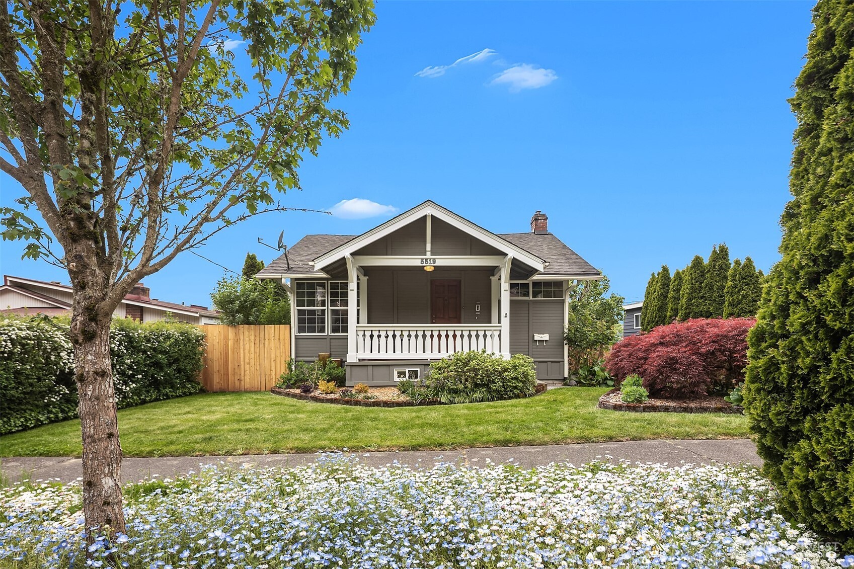 a front view of a house with garden
