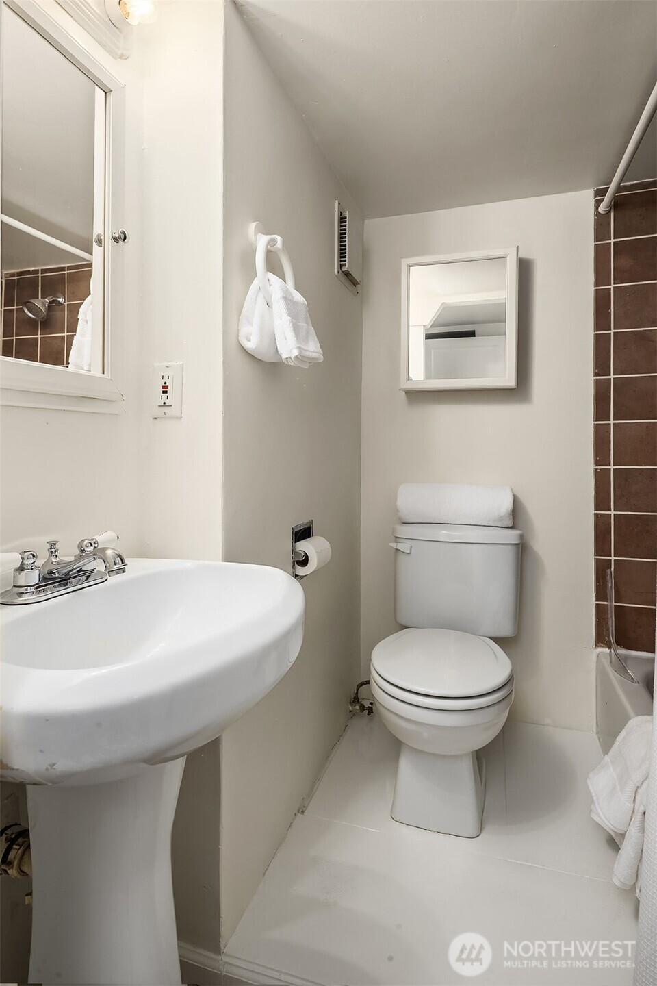 5519 18th Avenue South Seattle, WA 98108 - Photo 25 of 32 a bathroom with a sink a toilet and mirror