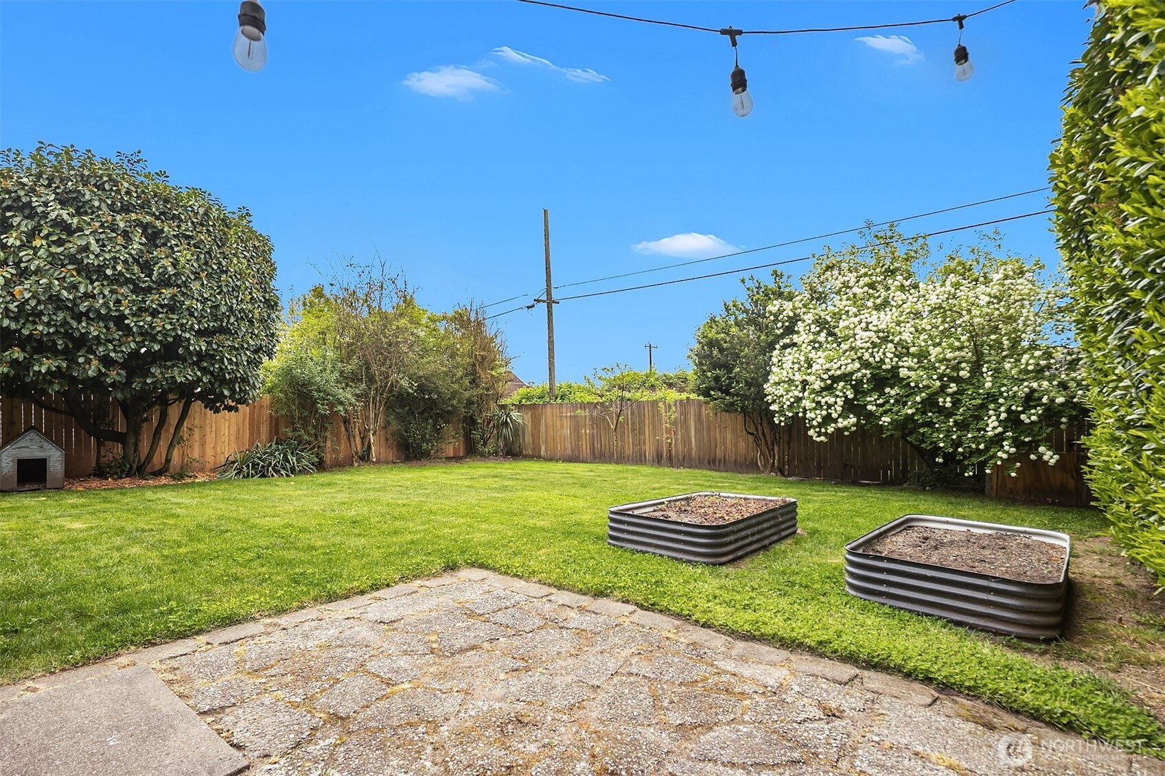 5519 18th Avenue South Seattle, WA 98108 - Photo 30 of 32 a view of a backyard with plants and outdoor seating