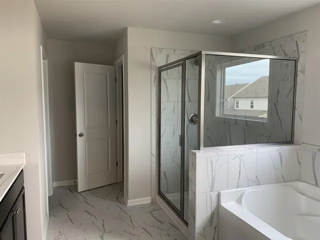 a living room with a couch and a dresser with wooden floor