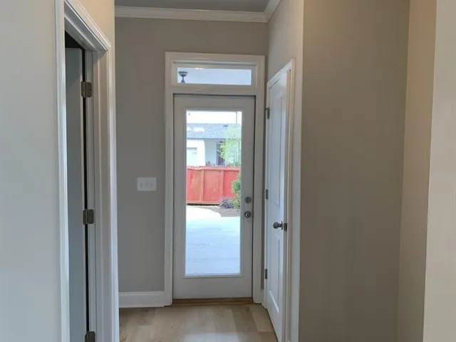 a view of a bathroom from a hallway