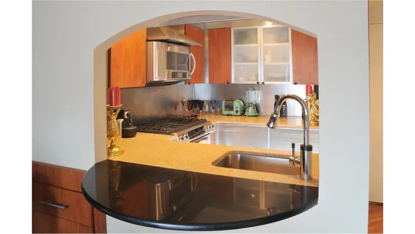 a kitchen with a sink and a window