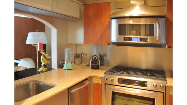 a kitchen with a stove and a sink
