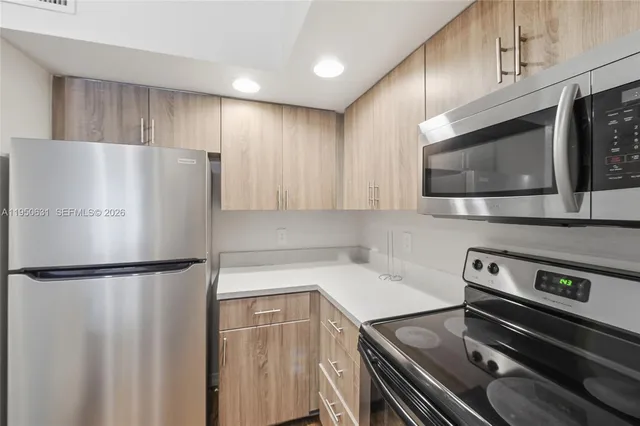 a view of a house with backyard sitting area and swimming pool