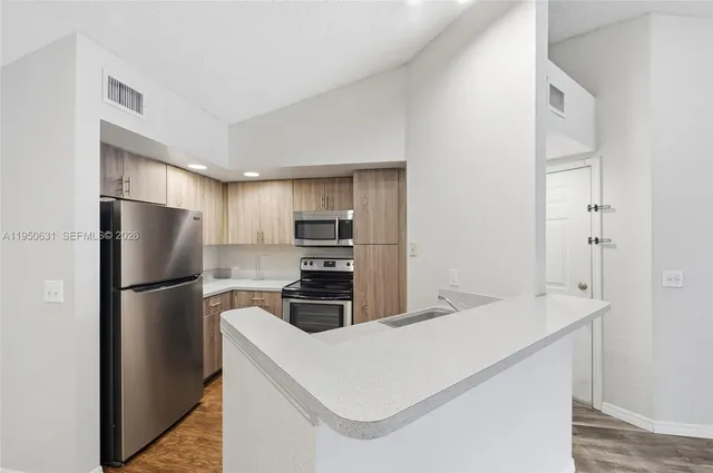 a view of a lake with houses in the back