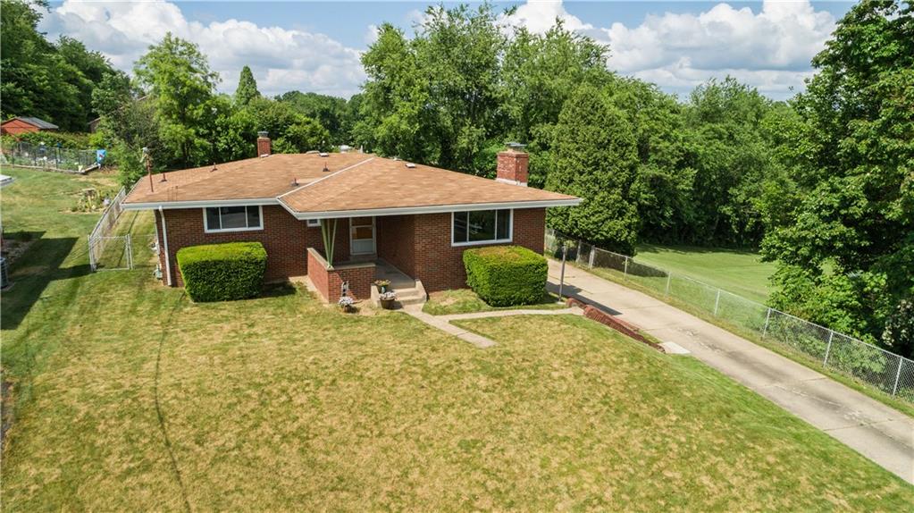 249 Barbara Drive McKees Rocks, PA 15136 - Photo 2 of 20 A pretty setting surrounded by lush trees and landscaping.
