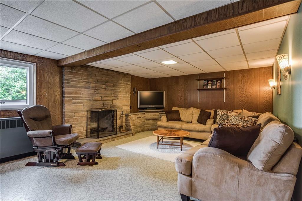 249 Barbara Drive McKees Rocks, PA 15136 - Photo 15 of 20 The lower level game room has a beautiful rustic stone fireplace with sconces, stone wall accents and plenty of room to entertain or watch the big game!