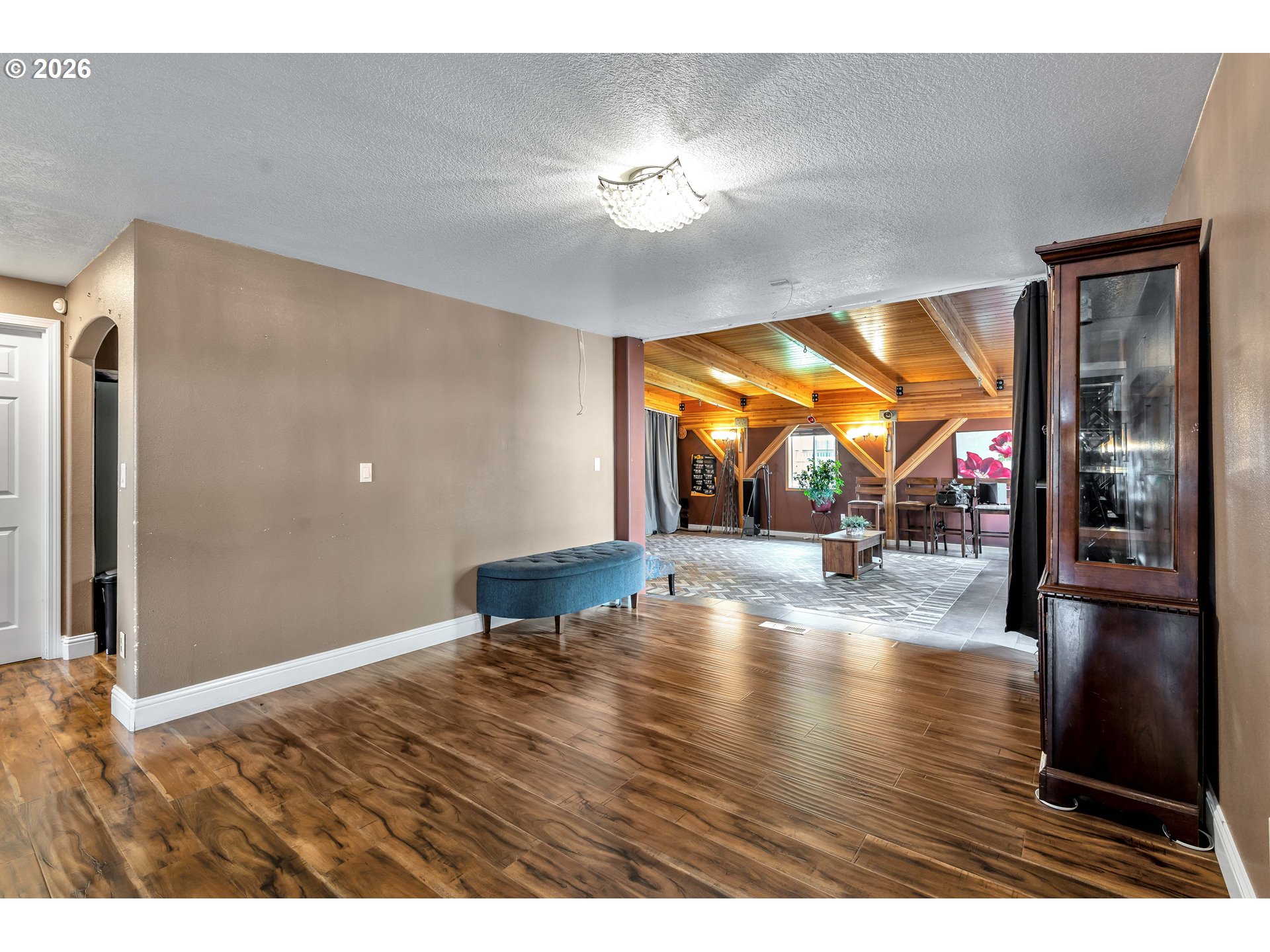 21498 Southwest Jay Street Beaverton, OR 97003 - Photo 9 of 47 a view of empty room with wooden floor and fan