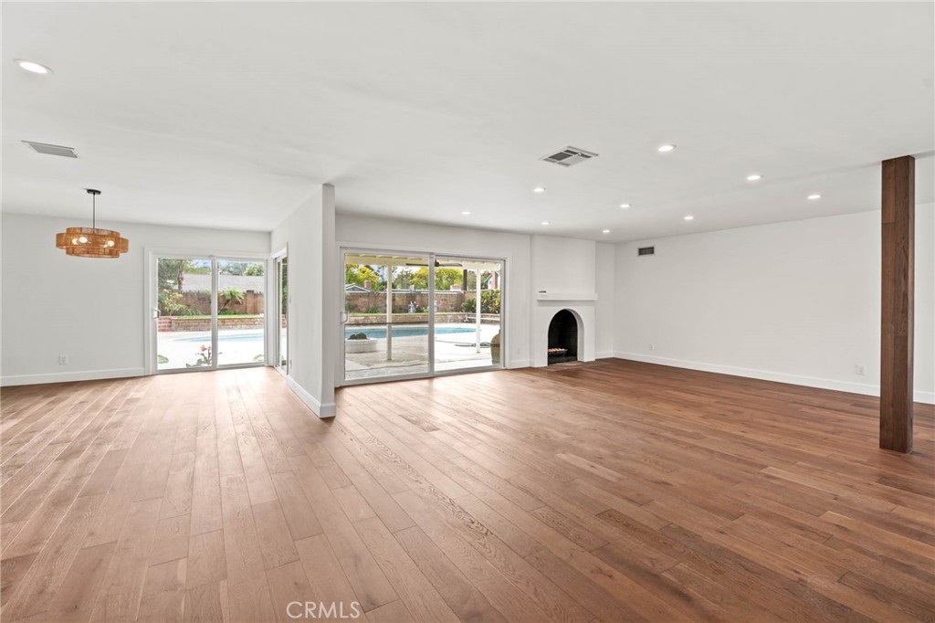 23642 Community Street West Hills, CA 91304 - Photo 11 of 38 a view of empty room with wooden floor and fan