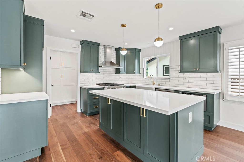 23642 Community Street West Hills, CA 91304 - Photo 15 of 38 a kitchen with a sink and a refrigerator