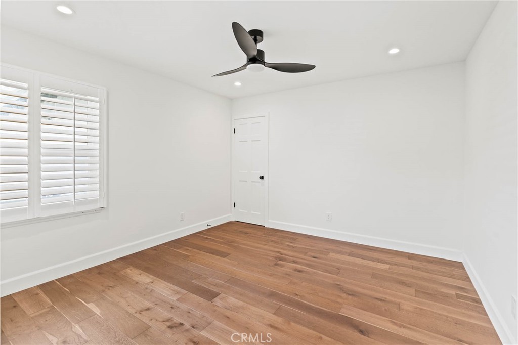 23642 Community Street West Hills, CA 91304 - Photo 17 of 38 a view of empty room with wooden floor and fan