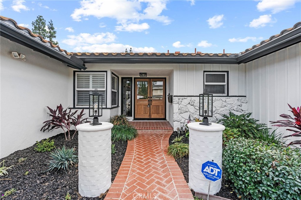 23642 Community Street West Hills, CA 91304 - Photo 2 of 38 a view of a house with backyard and sitting area