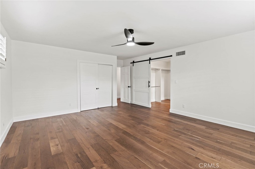 23642 Community Street West Hills, CA 91304 - Photo 24 of 38 a view of empty room with wooden floor and ceiling fan