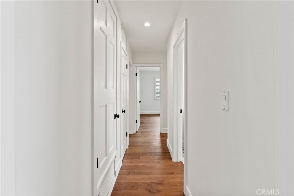 23642 Community Street West Hills, CA 91304 - Photo 29 of 38 a view of a hallway with wooden floor and staircase