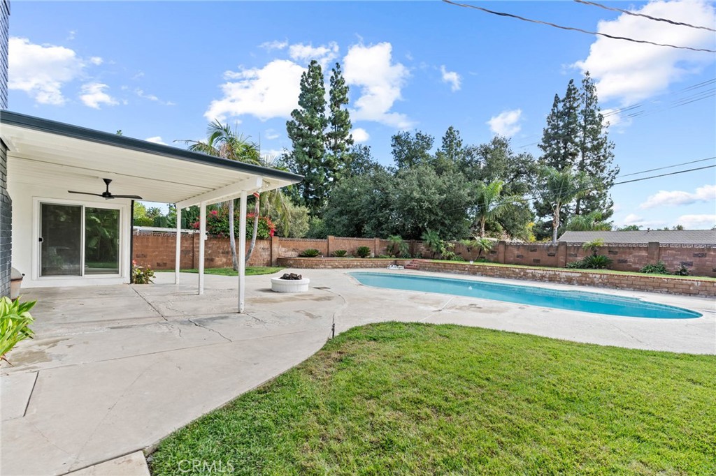 23642 Community Street West Hills, CA 91304 - Photo 30 of 38 a view of a house with a backyard and a patio