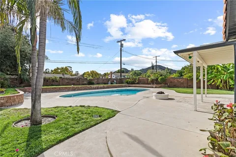 a view of a patio with a fountain