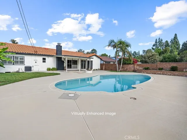 a view of a house with swimming pool