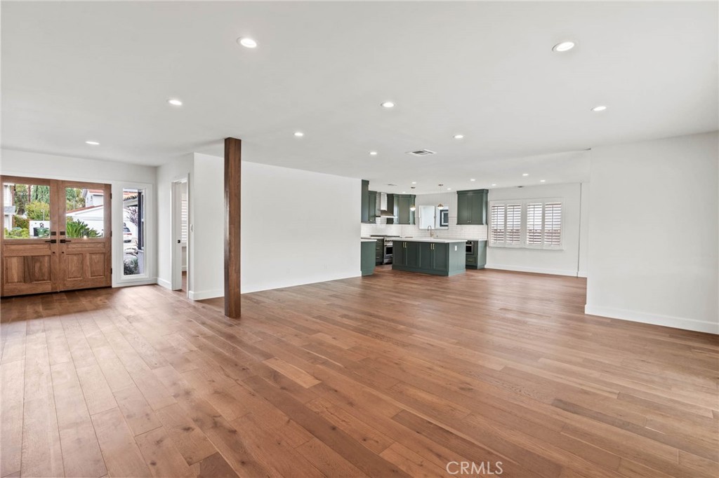 23642 Community Street West Hills, CA 91304 - Photo 10 of 38 an empty room with wooden floor and windows