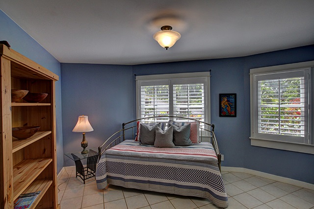 65 North Holokai Road Haiku, HI 96708 - Photo 12 of 23 a bedroom with a bed and window