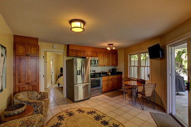 65 North Holokai Road Haiku, HI 96708 - Photo 17 of 23 a kitchen with stainless steel appliances granite countertop a refrigerator and a stove top oven