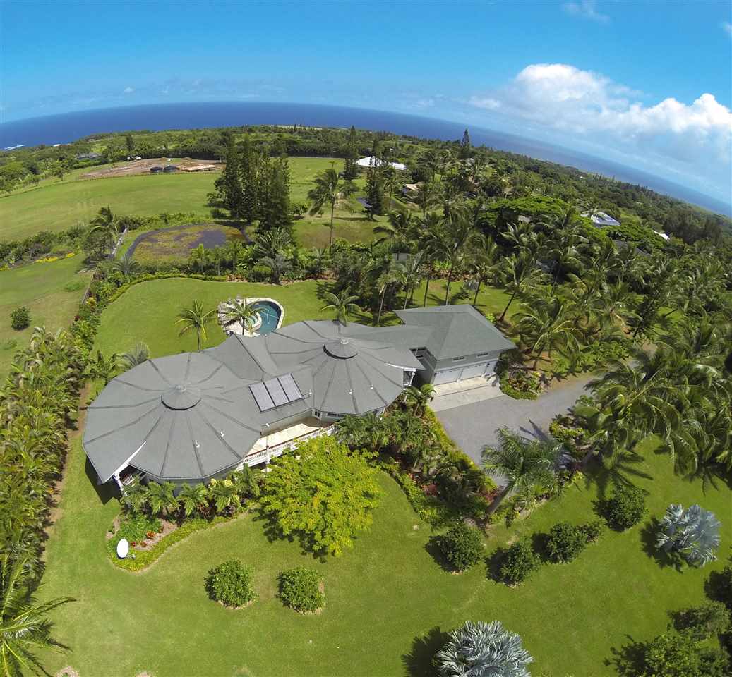 65 North Holokai Road Haiku, HI 96708 - Photo 22 of 23 a view of a lake with a yard