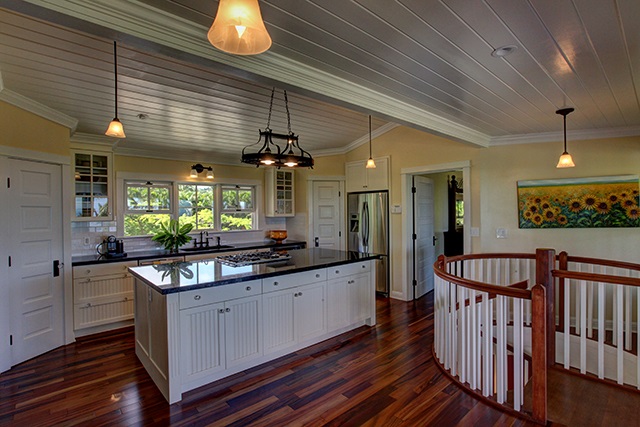 65 North Holokai Road Haiku, HI 96708 - Photo 3 of 23 a large kitchen with kitchen island a stove a sink a dining table and chairs with wooden floor