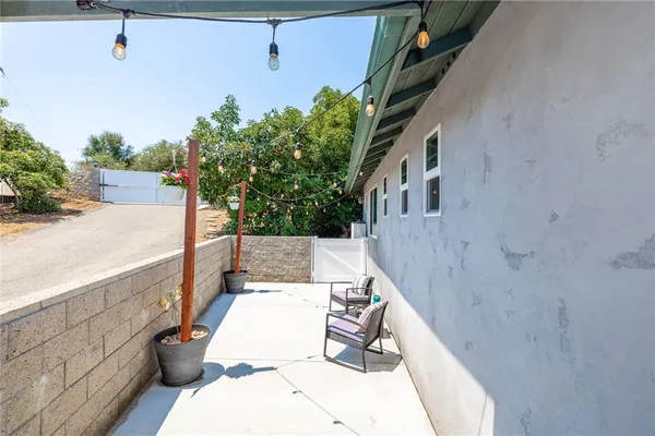 a view of balcony with furniture