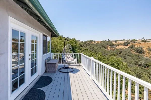 a view of balcony with furniture
