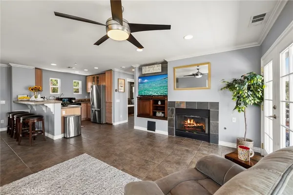 a living room with furniture and a fireplace