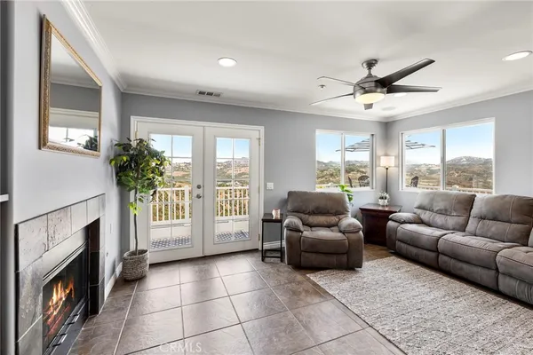 a living room with furniture and a fireplace
