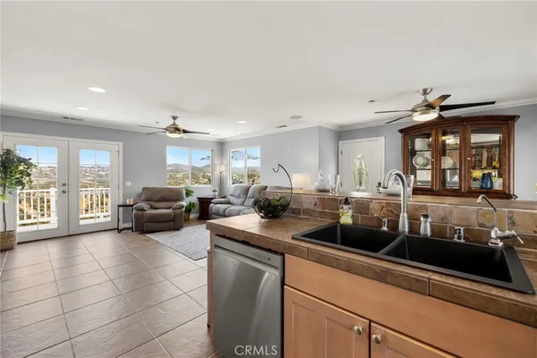 a kitchen with a sink and a stove top oven