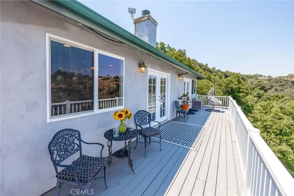 a view of balcony with wooden floor